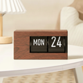 Flip calendar clock with walnut frame, studio shot